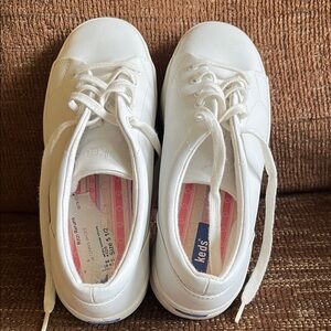 Nearly new white Keds tennis shoe.